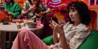 A young woman looking at her phone.